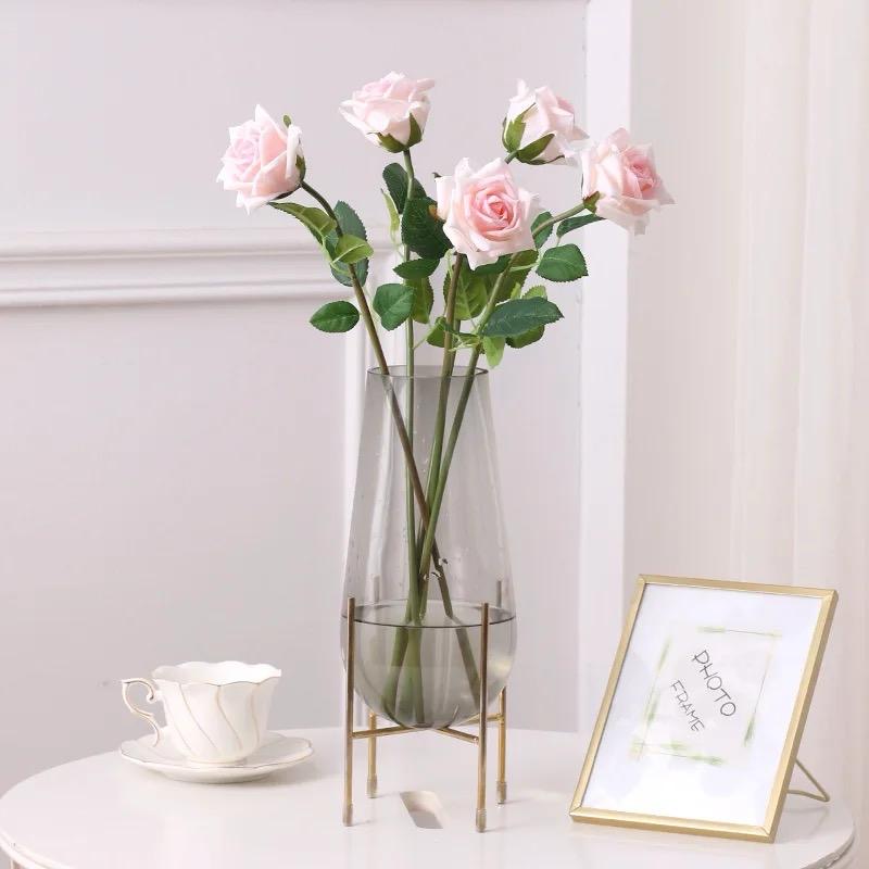 Modern creative dark glass vase with a gold stand