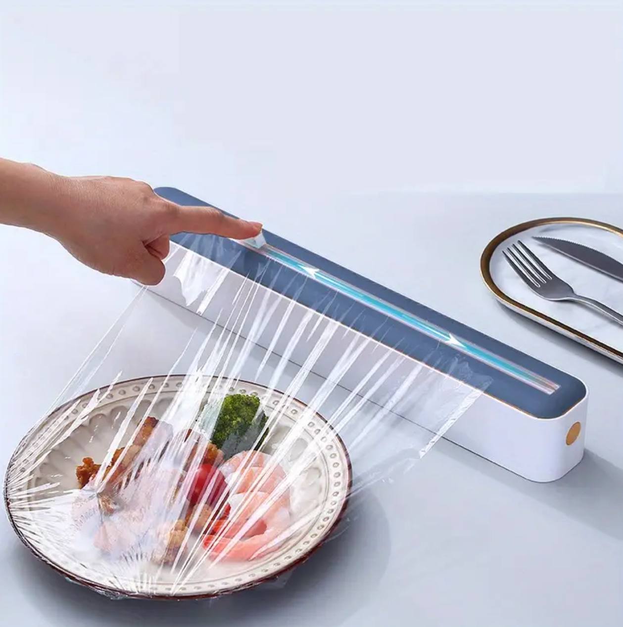 Plastic wrap cutter / cling film dispenser