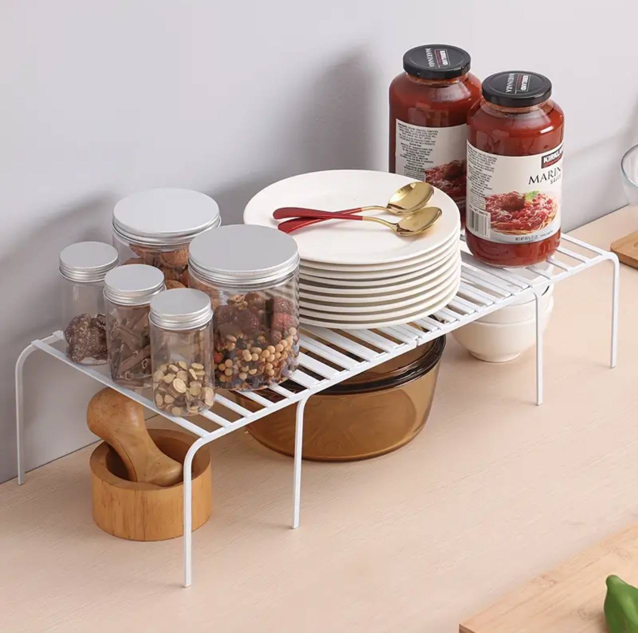 Expandable shelf raiser