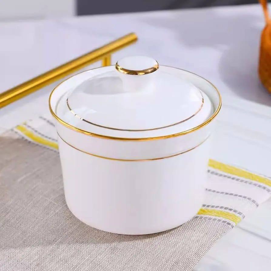 Ceramic sugar dish white with gold ring.