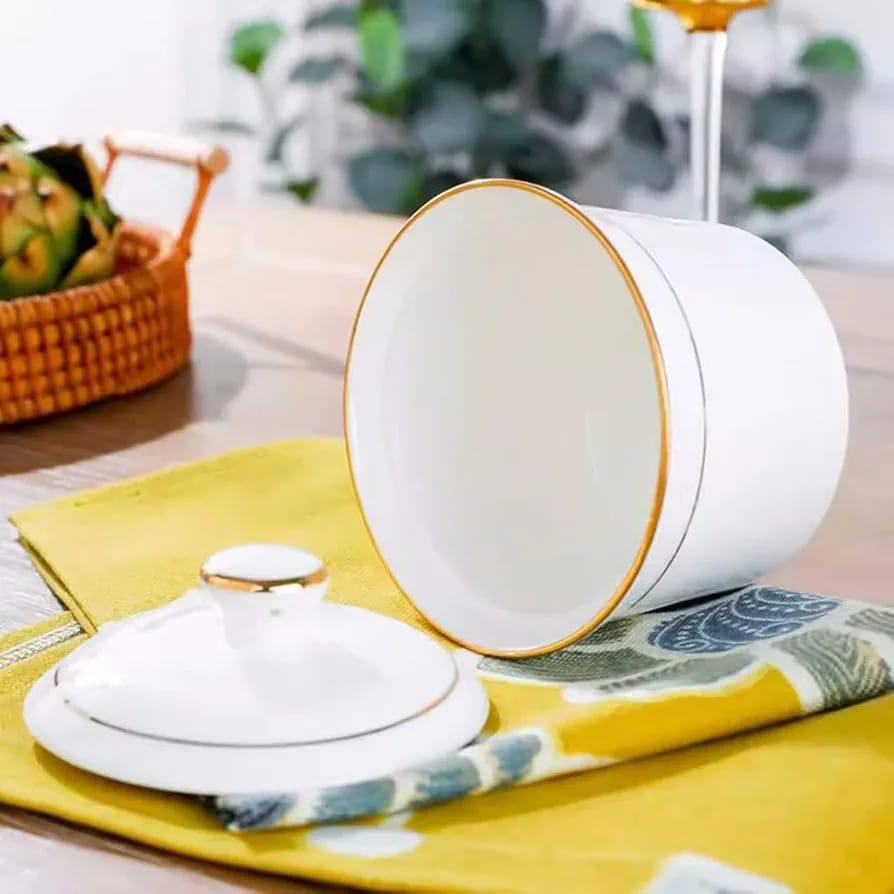 Ceramic sugar dish white with gold ring.