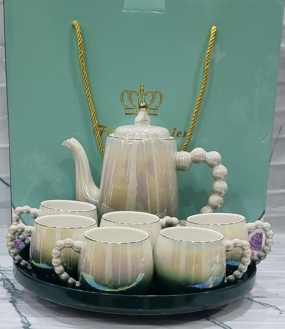 Fine ceramic 8pc Rotating tray tea set with 6 cups and kettle
