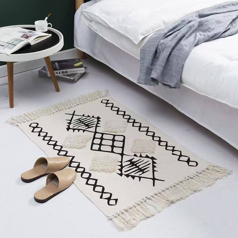 Bohemian Nordic style bedroom rug with tassels
