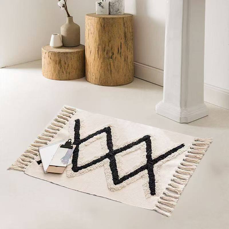 Bohemian Nordic style bedroom rug with tassels