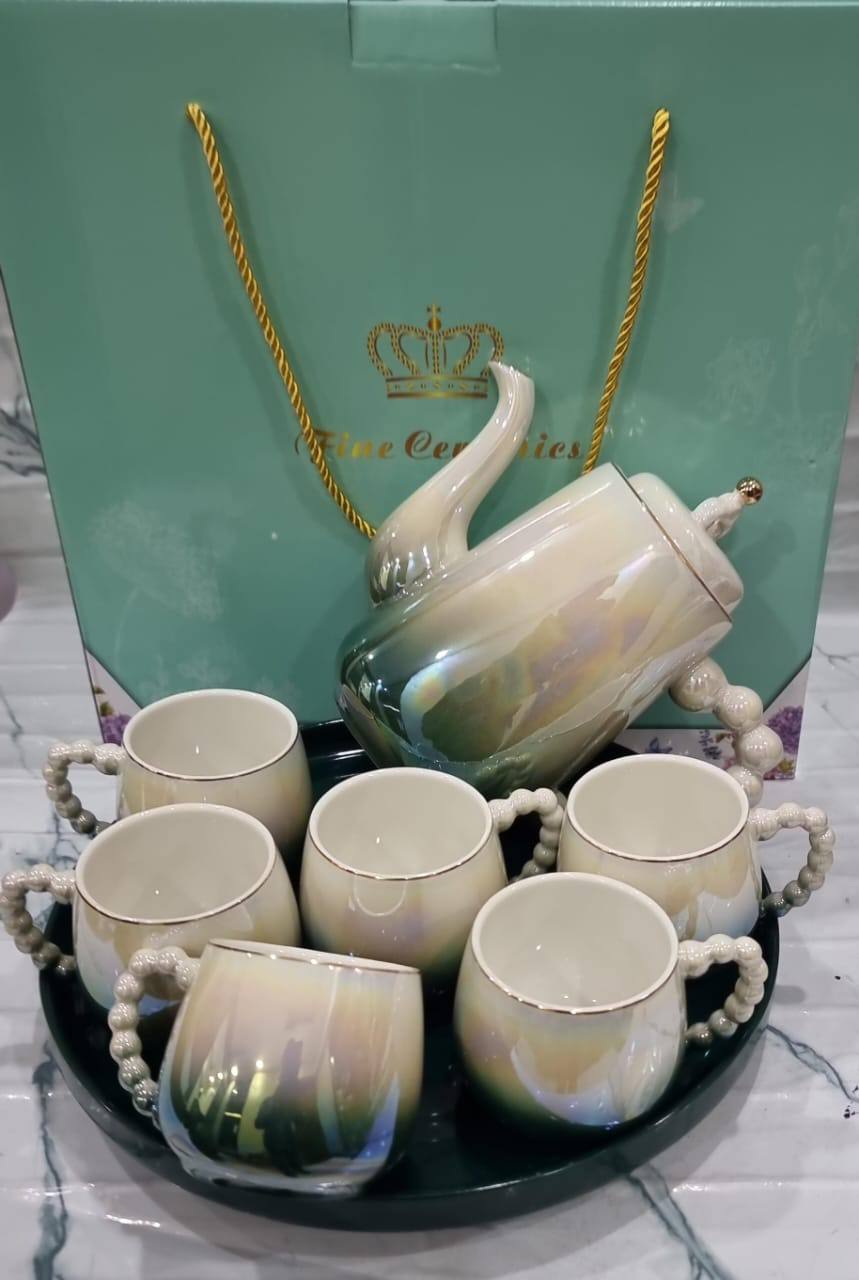 Fine ceramic 8pc Rotating tray tea set with 6 cups and kettle
