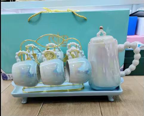 Fine ceramic 8pc Rotating tray tea set with 6 cups and kettle