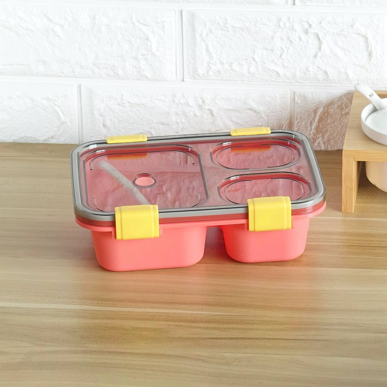 Partioned lunch/snack box with a spoon