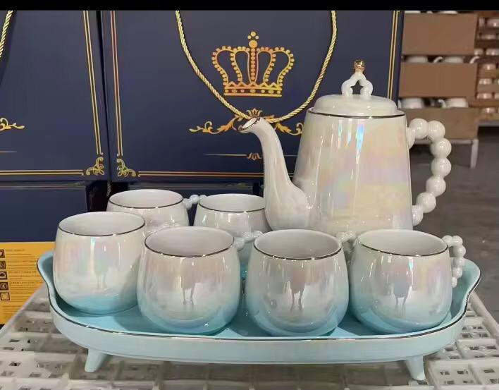 Fine ceramic 8pc Rotating tray tea set with 6 cups and kettle