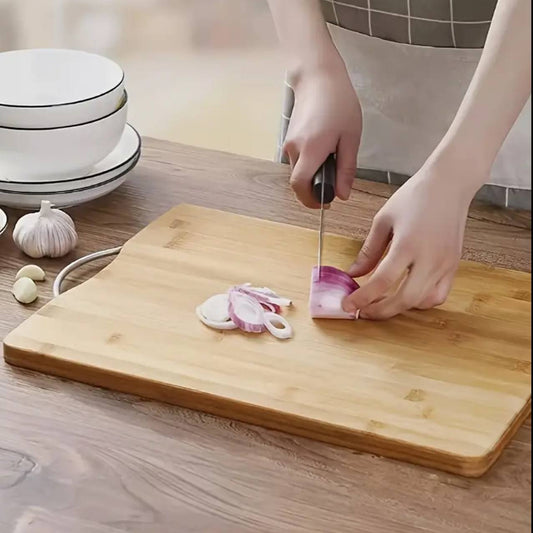 Heavy wooden chopping board with metallic handle.