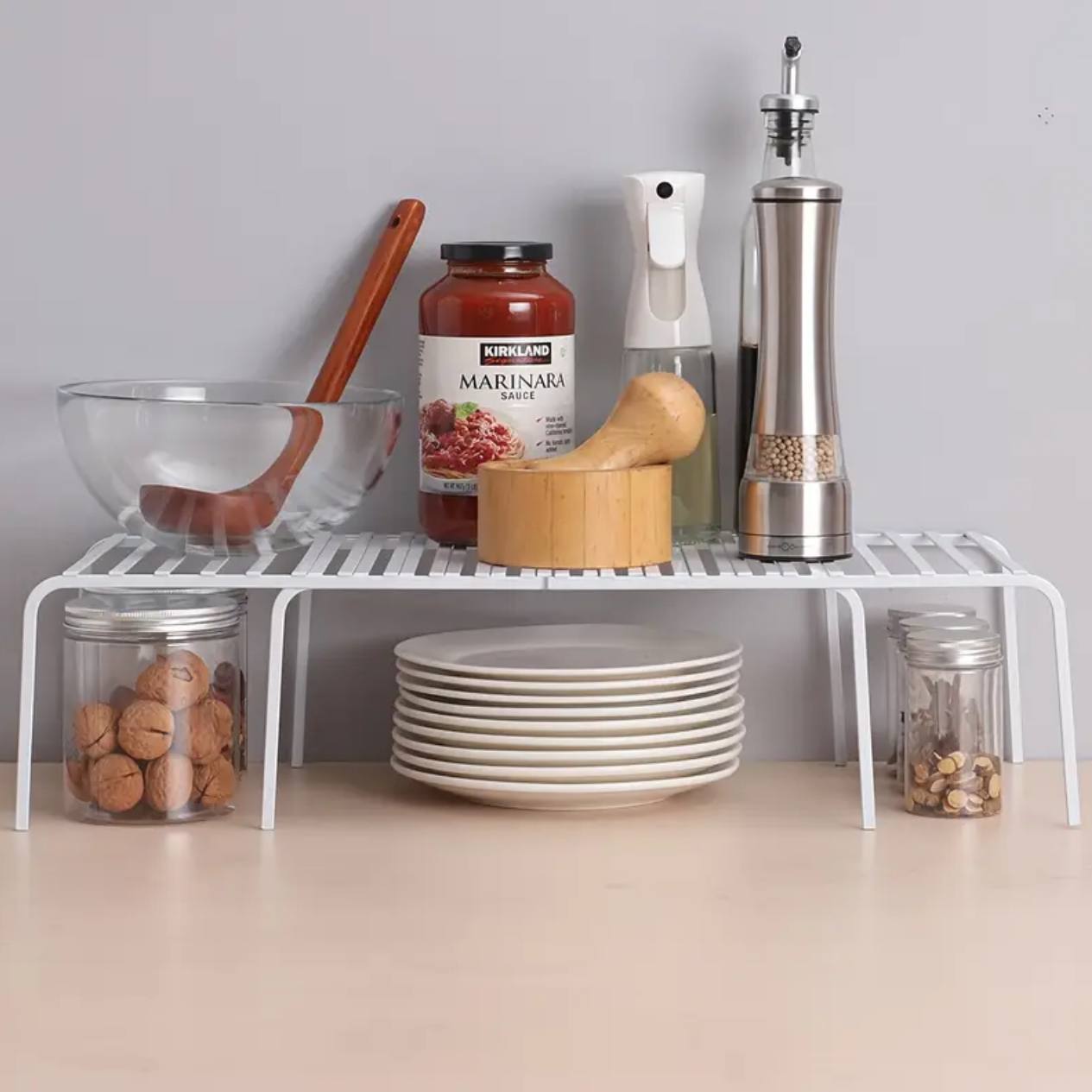 Expandable shelf raiser