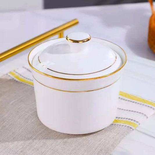 Ceramic sugar dish white with gold ring.