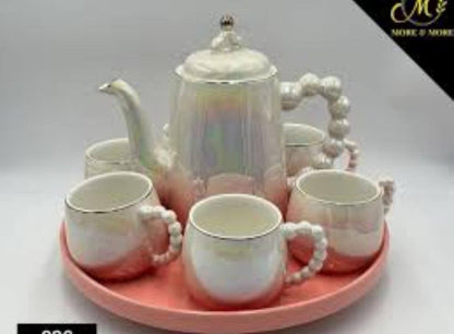 Fine ceramic 8pc Rotating tray tea set with 6 cups and kettle