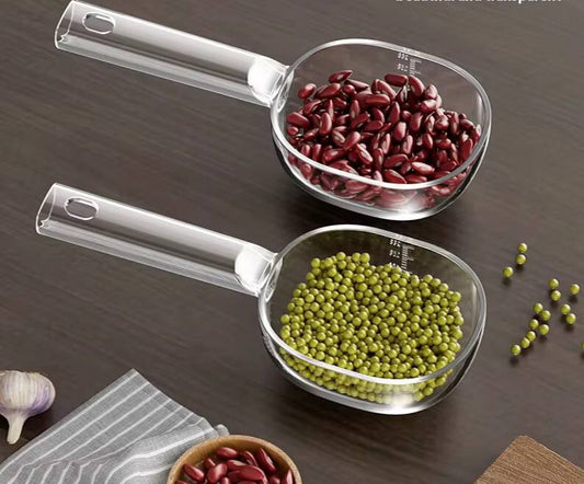Acrylic  scoop with a long handle and clearly marked measurements