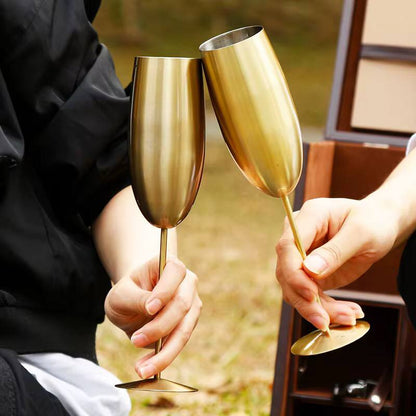 A pair of Gold Stainless steel wine glass