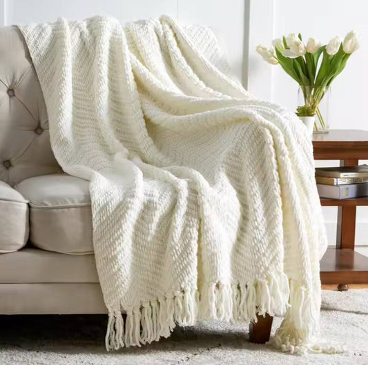 Textured knitted heavy throw blanket with tassels