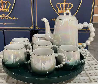 Fine ceramic 8pc Rotating tray tea set with 6 cups and kettle