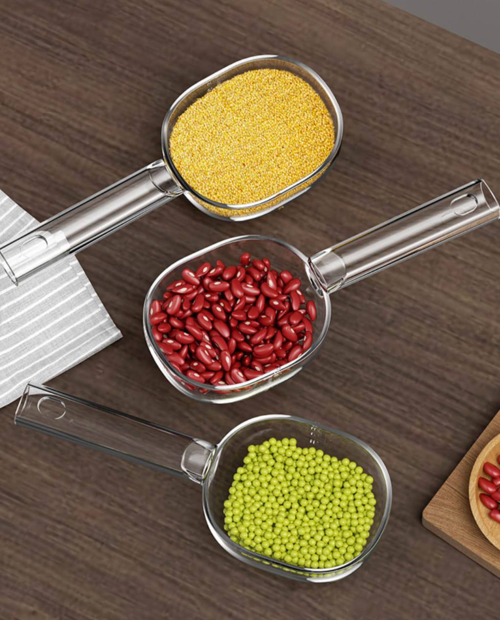 Acrylic  scoop with a long handle and clearly marked measurements