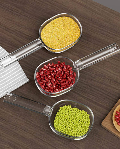 Acrylic  scoop with a long handle and clearly marked measurements