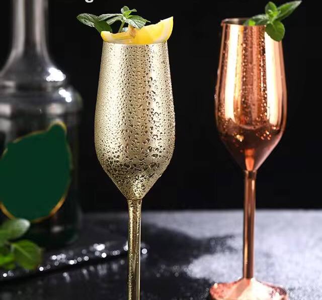 A pair of Gold Stainless steel wine glass
