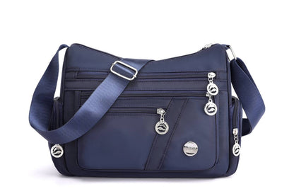 Multi-comnartment cross body bag