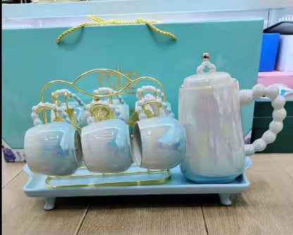 Fine ceramic 8pc Rotating tray tea set with 6 cups and kettle