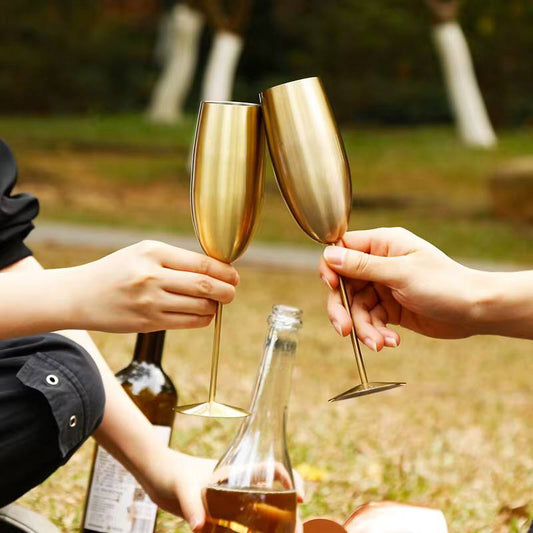 A pair of Gold Stainless steel wine glass