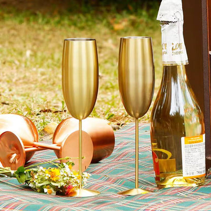 A pair of Gold Stainless steel wine glass