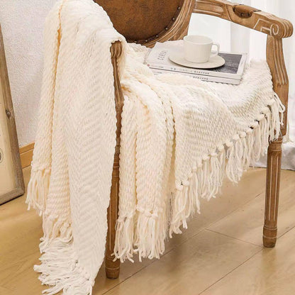 Textured knitted heavy throw blanket with tassels