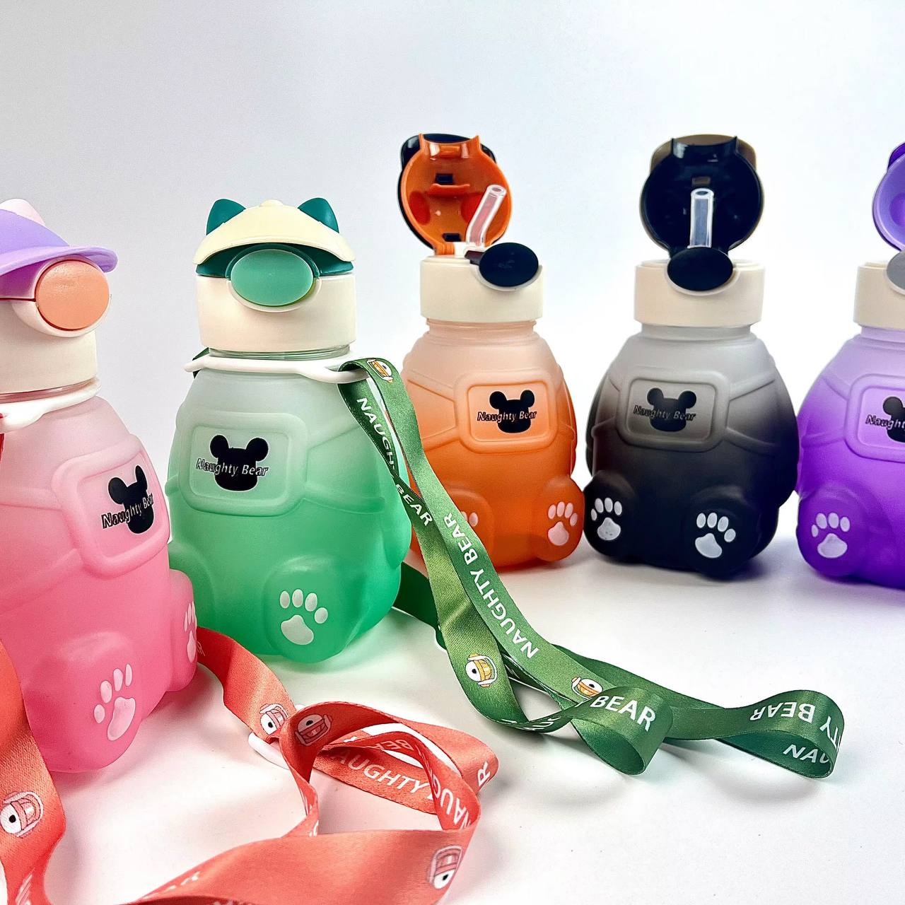 Adorable bear-shaped bottle with a stylish hat or headphone design, sturdy build, and matching strap.