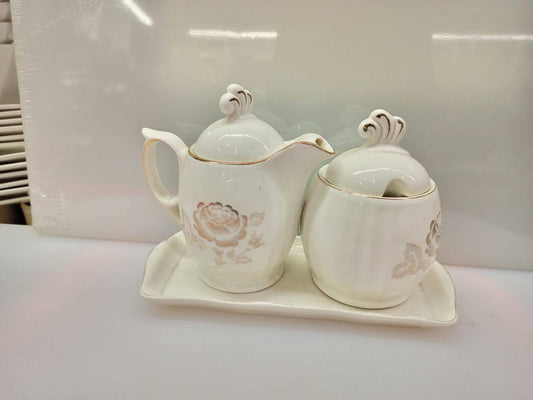 Sugar dish plus milk pot